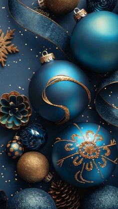 blue and gold christmas ornaments on a dark background