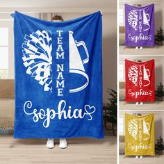 a woman standing in front of a blue towel with the words team name esopha on it