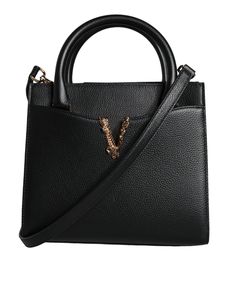 Introducing the Versace Virtus Top Handle Leather Bag: designed with the iconic brand logo, a sleek solid color, and a convenient crossbody strap. This versatile piece can also be worn as a crossbody tote bag and is crafted with 100% VL and 100% CO materials. The interior features a black lining with an inner pocket, while the exterior boasts two handles and a detachable, adjustable shoulder strap. Complete with logo-engraved metal hardware.    Model: Crossbody tote bag   Color: Black   Black in Engraved Metal, Versace Bags, Crossbody Tote Bag, Metal Engraving, Boot Pumps, Crossbody Tote, Crossbody Strap, Satchel Bags, Cross Body Handbags