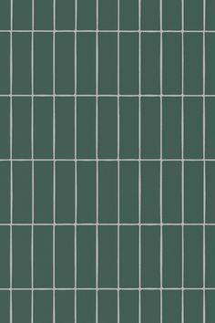 a green tiled wall with white lines on it