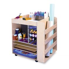 a wooden cart filled with lots of craft supplies