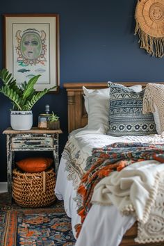 a bedroom with blue walls and white bedding has a plant on the nightstand next to it