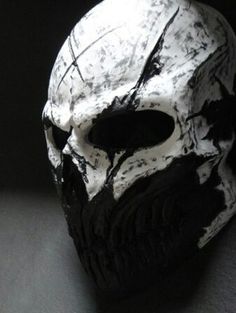 a white and black skull mask on a table