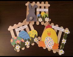 four wooden pegs decorated with easter pictures and bunny, chick, rabbit on the other side