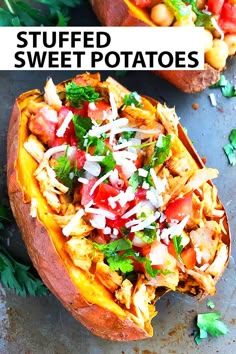 two stuffed sweet potatoes topped with meat and vegetables