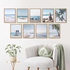 a white chair sitting in front of a wall filled with pictures