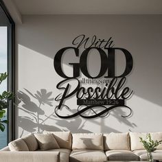 a living room filled with furniture and a wall mounted sign that says, with god all things are possible