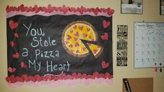 a sign that says you stole a pizza my heart on the wall next to a calendar