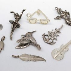 9 Vintage Sterling Silver 925 Charms, Jewelry, Accessories, Hummingbird, Feather, Helms Wheel And Anchor, Guitar, Cheerleader, Sunglasses, Incognito, Hand, Angel, Precious Metal, Fun, Free Shipping In The U.S. Hummingbird Feather, Colorful Feathers, Charm Jewelry, Vintage Sterling Silver, Womens Jewelry Bracelets, Precious Metals, Jewelry Accessories, 925 Sterling Silver, Women Jewelry