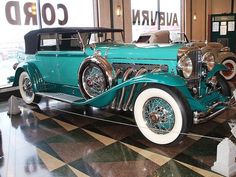 an antique car on display in a museum