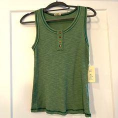 Green Tank Top With Functional Wooden Buttons. Tags Still Attached And Never Worn. 32% Cotton 60% Polyester 8% Spandex Retro Green Cotton Tank Top, Green Sleeveless Buttoned Tank Top, Bohemian Green Cami Tank Top, Green Tank Top With Built-in Bra For Summer, Olive Green Tank Top, Green Tank Top, Green Tank, Tank Tops, Womens Tops