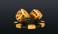 two golden dices sitting on top of each other