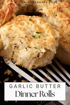 garlic butter dinner rolls on a fork with the title overlay reading garlic butter dinner rolls