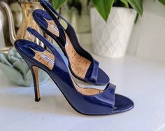 "Nearly mint, vtg genuine Manolo Blahnik slingback patented leather navy blue heels in size 39. Handmade in Italy, all leather with a layer of cork with gold leaf details inside the inner sole. 4\" heel. No wear on heels or leather, tiny bit of wear on the outer sole and inside the toes (see close up photo)" Manolo Blahnik Slingback, Navy Blue Heels, Silver Clutch, Red Belt, Wedding Purse, Blue Heels, Slingback Shoes, Close Up Photos, Blue Shoes