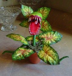 a fake flower with its mouth open on a table