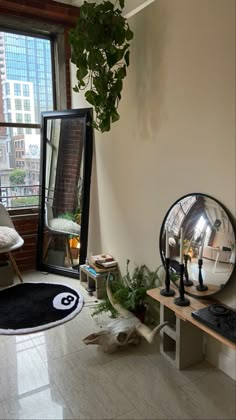 a living room with plants and mirrors on the wall