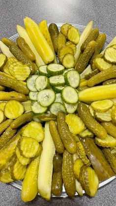 a platter filled with cucumbers and pickles