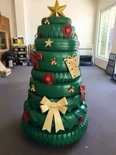 a large christmas tree made out of tires