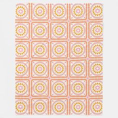 an orange and white pattern with circles on the bottom, in different sizes and colors