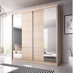 an image of a modern bedroom setting with mirrored closet doors