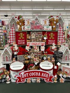 a display in a store filled with lots of christmas decorations and gingerbreads on the shelves