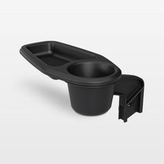 a black cup holder with an open lid and two cups in the bottom, on a white background