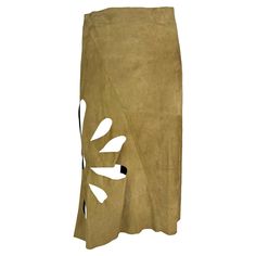 Presenting a fabulous tan suede Gucci midi skirt, designed by Tom Ford. From the Spring/Summer 2002 collection, the black satin version of this skirt debuted on the season's runway as part of look 31. Constructed entirely of suede, this flared skirt is elevated with cut outs in the shape of a flower on one side. A must have for any Gucci by Tom Ford lover, this chic skirt is the perfect quiet luxury piece to add to any modern wardrobe! Approximate measurements: Size - 38IT Waistband to hem: 28" Flare Wrap Skirt, Suede Midi Skirt, Gucci By Tom Ford, Tom Ford Clothing, Chic Skirt, Satin Noir, Chic Skirts, Suede Skirt, Modern Wardrobe