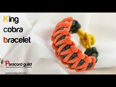 an orange and green paracord bracelet on a white background with the text king cobra bracelet