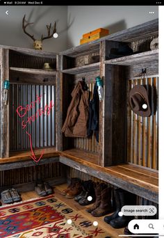 an image of a wooden bench with hats and coats hanging on the back wall in front of it