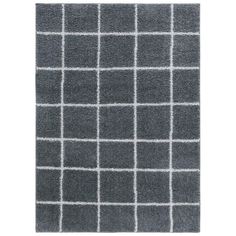 a gray and white rug with squares on it