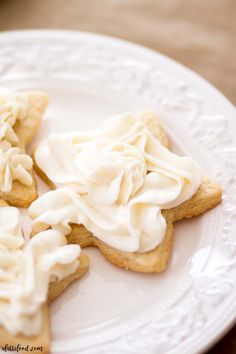 some cookies with icing on a white plate