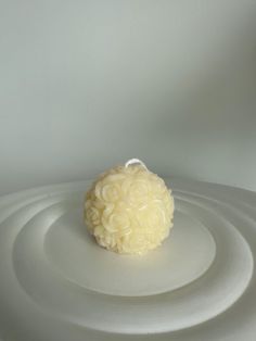 a round white object sitting on top of a table