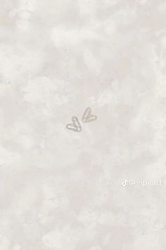 an image of a white marble background with two silver scissors on the left and right side