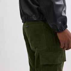 An elevated take on a military-inspired style these cargo pants are crafted of soft corduroy. Featuring a straight-leg silhouette and oversized utility pockets the sporty style is finished with a leather back patch and a Coach woven flag for a heritage touch. | Coach Corduroy Cargo Pants Size 36 - Olive Green Corduroy Cargo Pants, Branding Coach, Utility Pockets, Green Brands, Military Inspired, Pleated Pants, Cargo Pants Men, Back Patch, Cargo Trousers