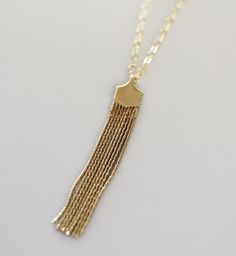 "Long Necklace Gold Tassel, Tassel Necklace, Layered Gold Necklace, Gold Tassel Long Necklace Pretty and Modern Necklace. A tassel chain fringe necklace that is pretty and simple for a everyday look. The tassel pendant is suspended from a delicate chain for a perfect layering necklace. Long necklaces are in! Available in sterling silver or 14k gold filled. Choose from a short or long tassel pendant. NECKLACE DESCRIPTION: - Short or Long Tassel Pendant - Short measures 1 5/8 inch long - Long meas Bohemian Gold Tassel Necklace For Gift, Bohemian Gold Tassel Necklace As Gift, Bohemian Gold Tassel Necklace, Fringe Long Necklace Gift, Fringe Long Necklace As A Gift, Long Fringe Necklaces For Gift, Fringe Long Necklace For Gift, Gold Long Drop Tassel Jewelry, Adjustable Gold Fringe Necklaces