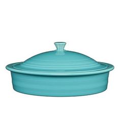 a large blue casserole dish with a lid on the side and a white background