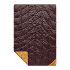 the quilted blanket is brown and orange