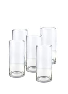 four clear glass tumblers sitting next to each other