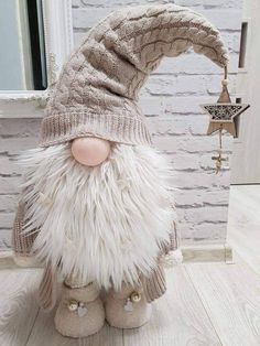 a stuffed gnome is standing in front of a mirror with his head turned to the side