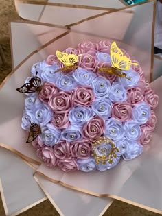 a cake decorated with pink and blue flowers