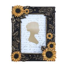 a frame with sunflowers and a silhouette of a woman