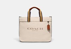 Canvas Tote Bag 38 | COACH OUTLET Modern Coach Shoulder Bag With Leather Trim, Coach Canvas Bag With Removable Pouch, Coach Canvas Bag With Leather Trim, Coach Canvas Shoulder Bag For Everyday, Coach Double Handle Canvas Bag, Coach Travel Bag In Canvas, Coach Canvas Bags With Double Handle, Coach Canvas Bag With Double Handles, Coach Canvas Travel Bag