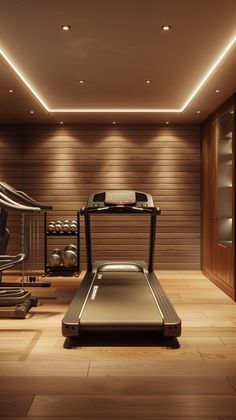 there is a treadmill and exercise equipment in this room with lights on the ceiling