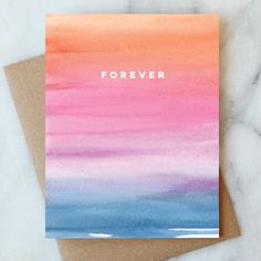 a card with the words forever written on it in pink, blue and orange watercolors