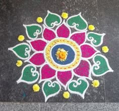 a colorful flower design on the ground