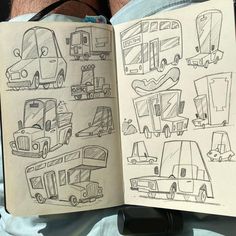 an open book with drawings of vehicles on it