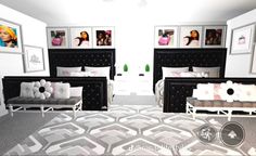 a bedroom with black and white furniture, pictures on the wall and carpeted floor