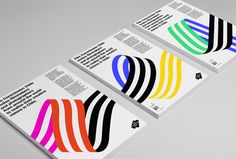 three business cards with different colors on them