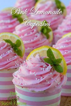 pink lemonade cupcakes with sprinkles and mint leaves on top