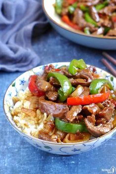 two bowls filled with stir fry beef and vegetables